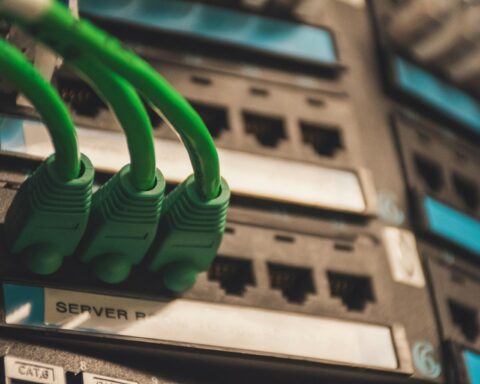 Green cables connect to an electronic device.