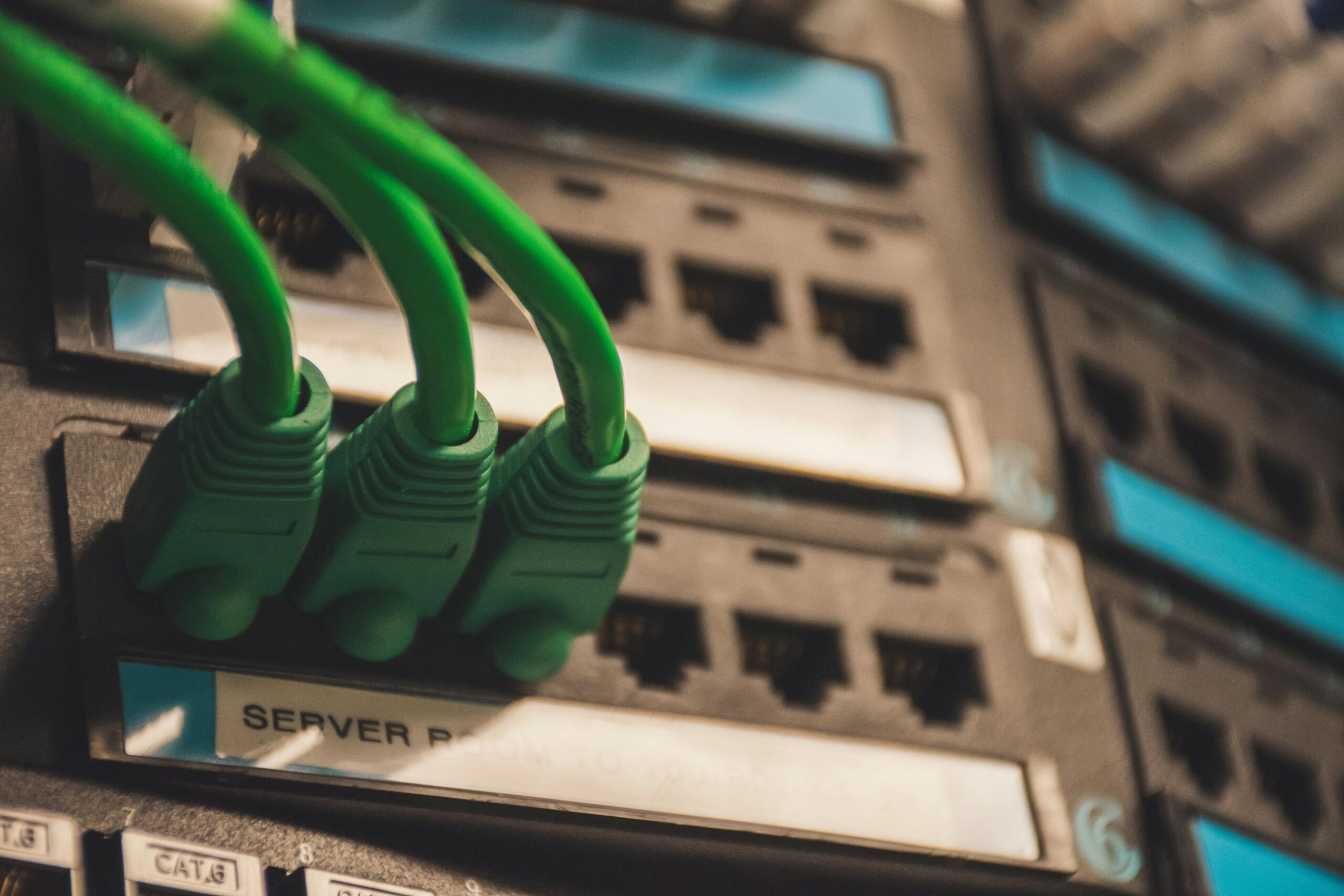 Green cables connect to an electronic device.