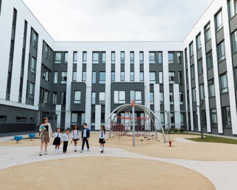 A school courtyard with middle schoolers.