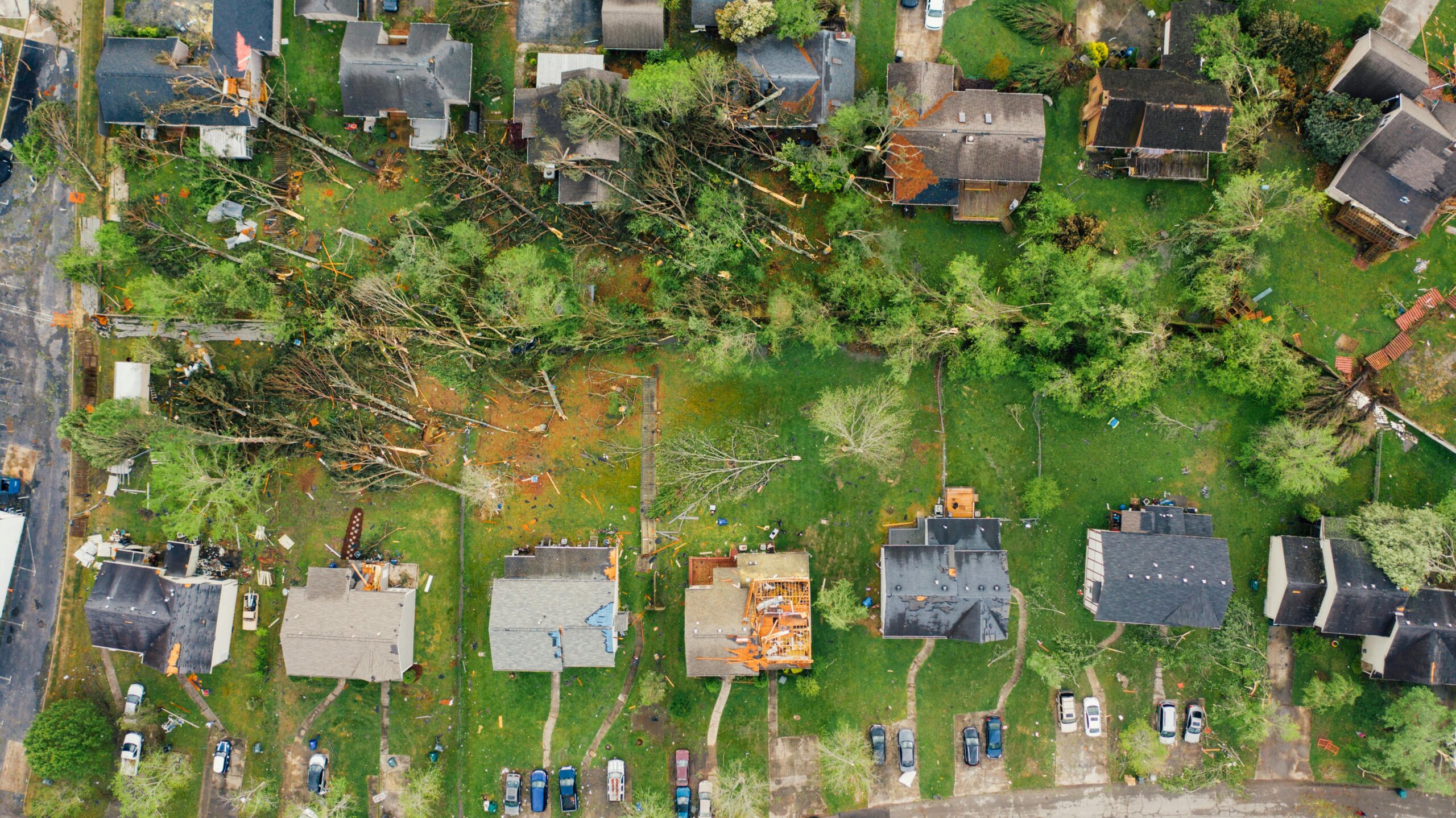 An aerial view of a housing neighborhood destroyed by a tornado.