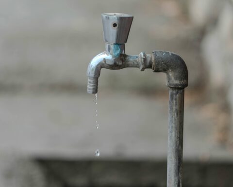 Water drips from a faucet.