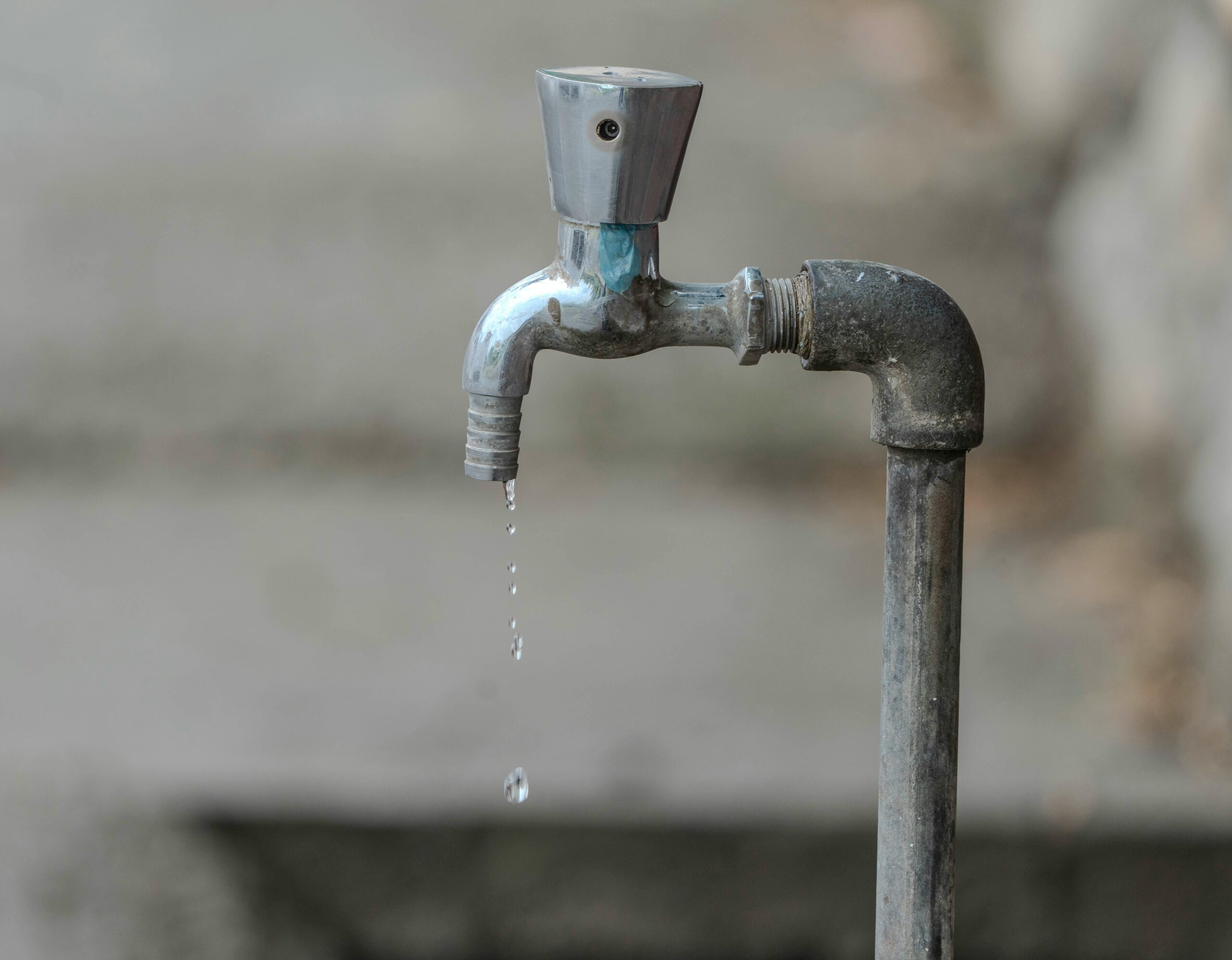 Water drips from a faucet.