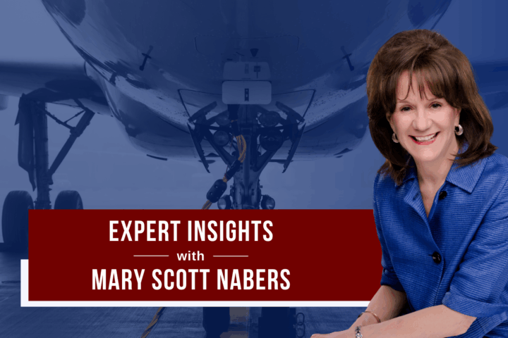 Mary Scott Nabers before a parked airplane for her weekly column about airport projects.