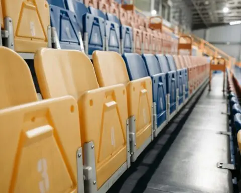Multicolored arena seats in a basketball and volleyball arena.