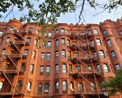 A tall, red brick housing development in Boston, Massachusetts.