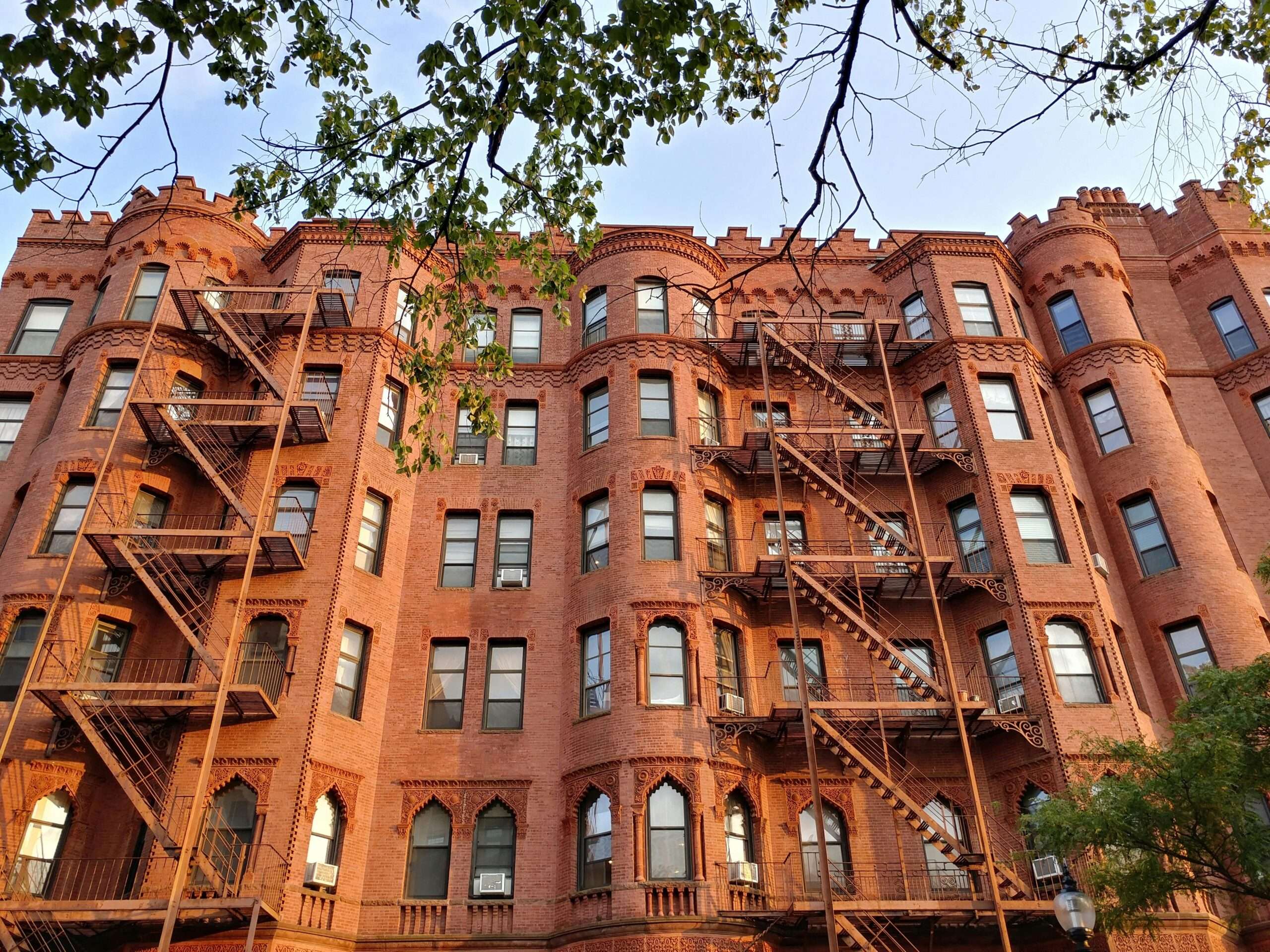 A tall, red brick housing development in Boston, Massachusetts.