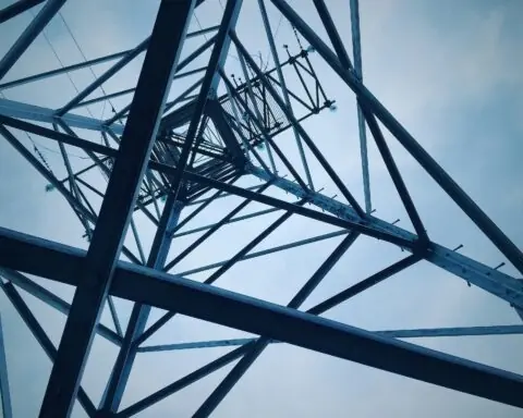 The underside of a electric transmission tower.