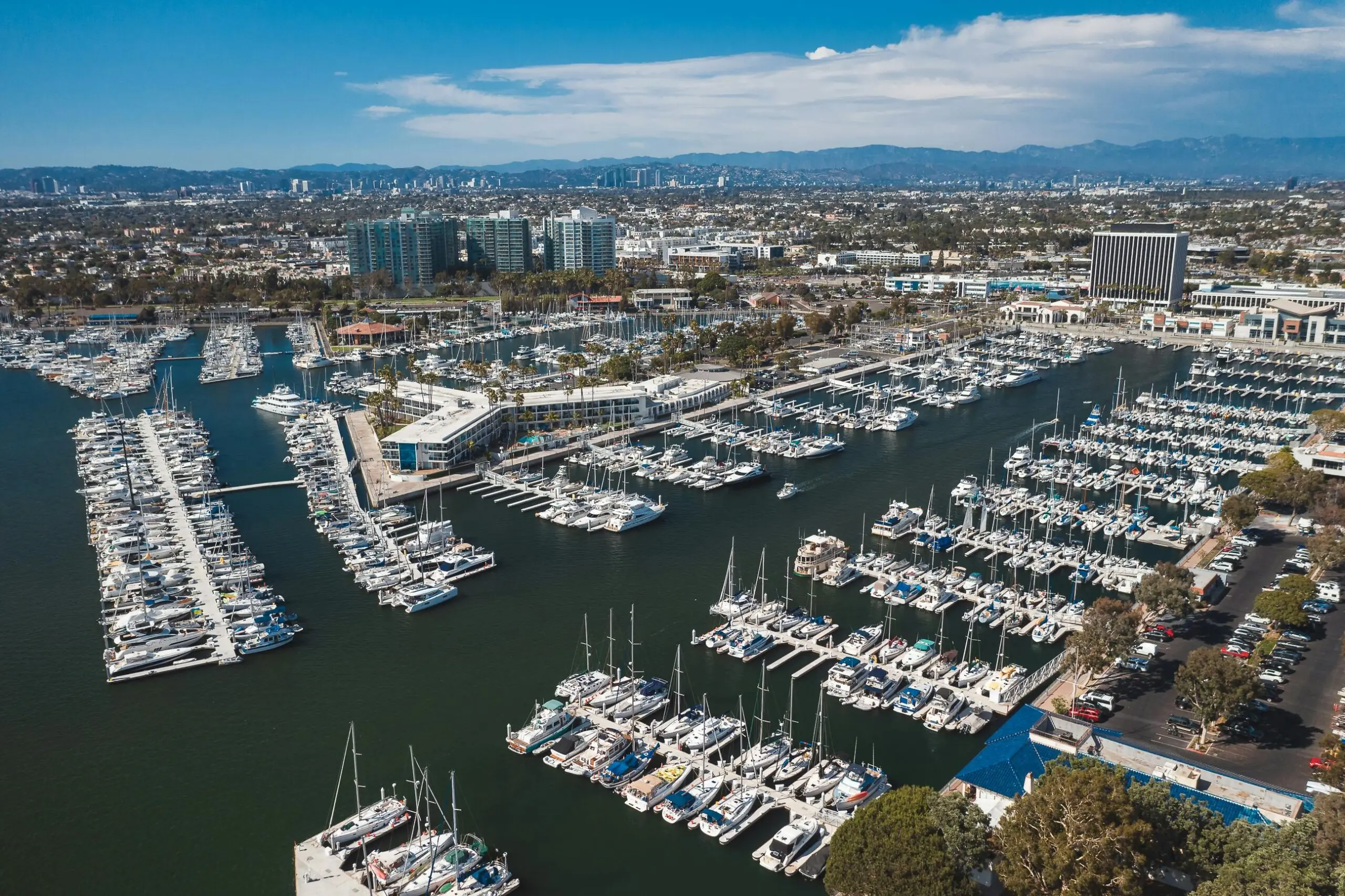 An aerial view of the Port of Los Angeles with yachts and other exotic boats docked.