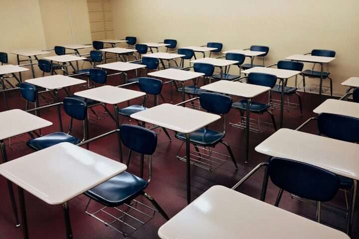 A series of desks in a classroom.