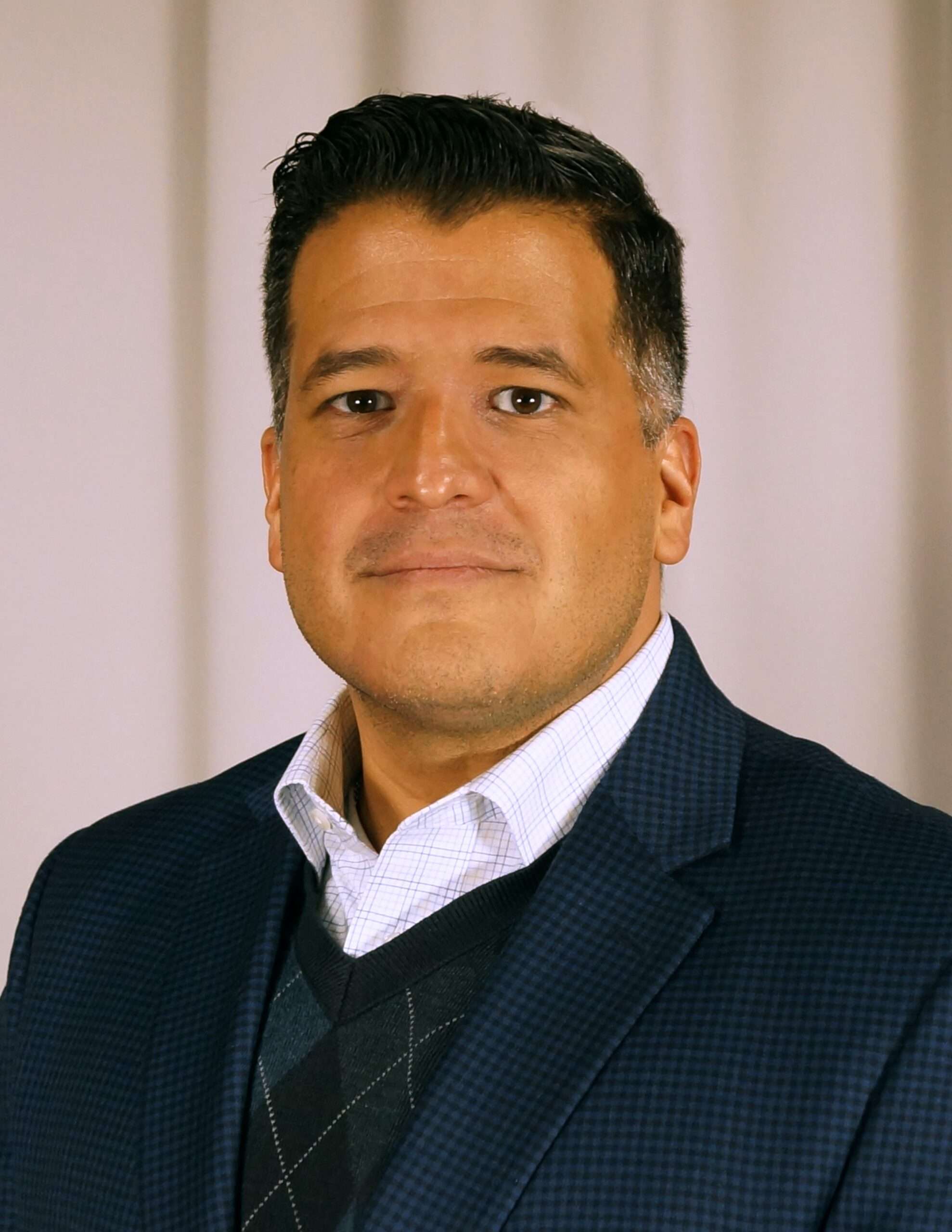 A portrait of José R. Madrigal.