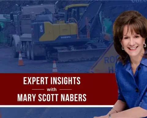 Mary Scott Nabers before roadway construction equipment for her weekly colulmn.
