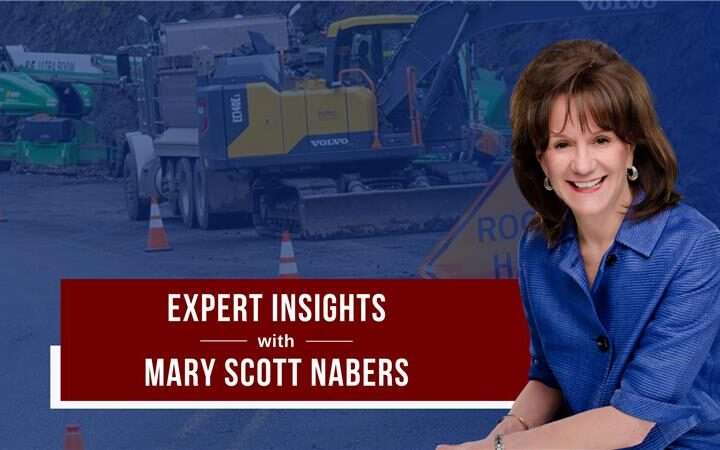 Mary Scott Nabers before roadway construction equipment for her weekly colulmn.