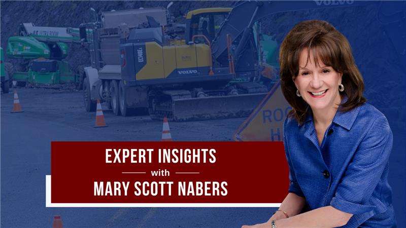 Mary Scott Nabers before roadway construction equipment for her weekly colulmn.