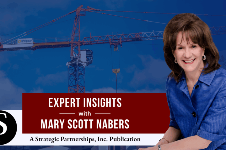 Mary Scott Nabers before a construction crane for her weekly column.
