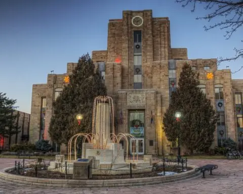 The Boulder City Courthouse in Colorado with Christmas lights decorating the municipal building.