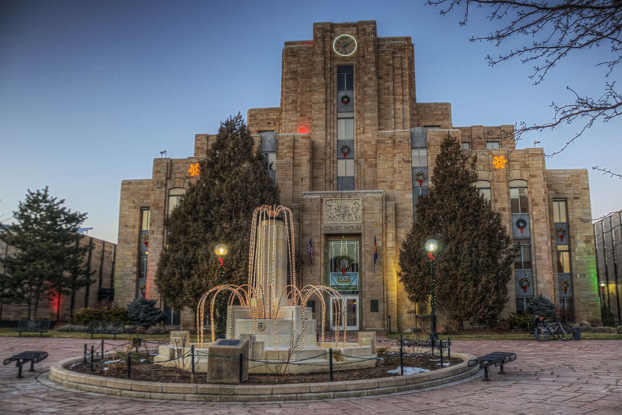 The Boulder City Courthouse in Colorado with Christmas lights decorating the municipal building.