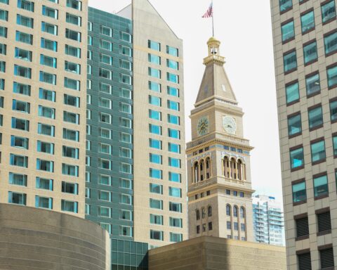 The Bell Tower in Denver, Colorado nearby other sky scrappers.