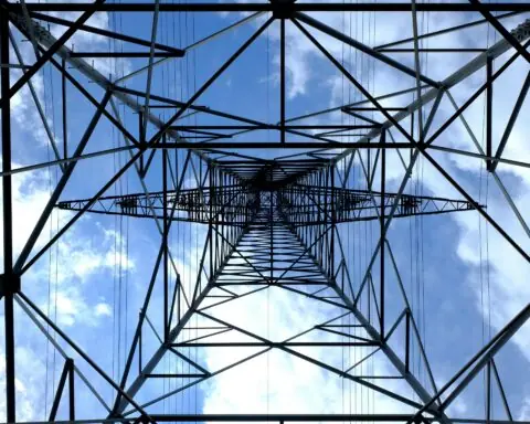 The underside of a electric transmission tower.