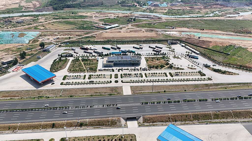 An aerial view of a highway service plaza.