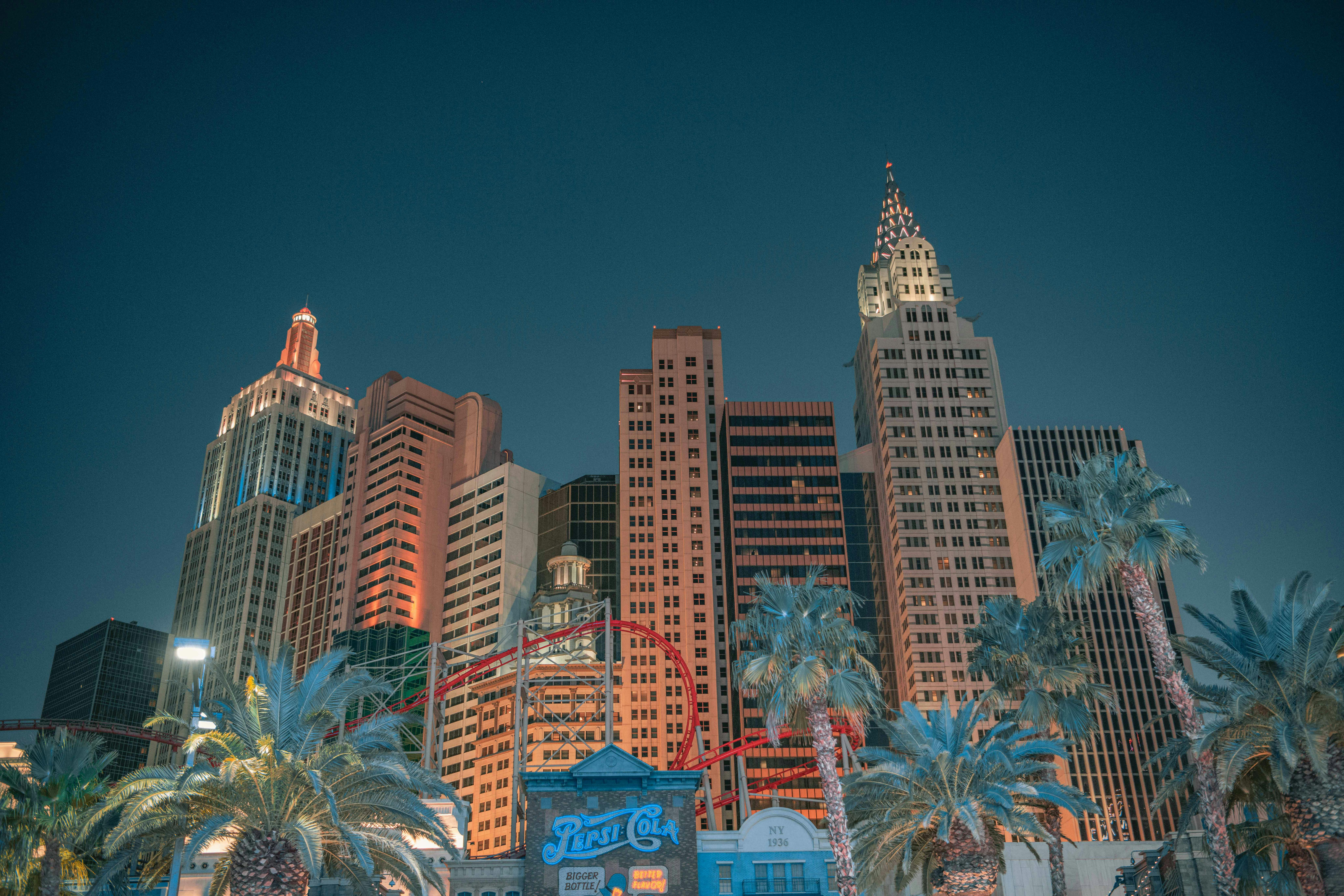 The Las Vegas skyline from the ground against a dark night sky.