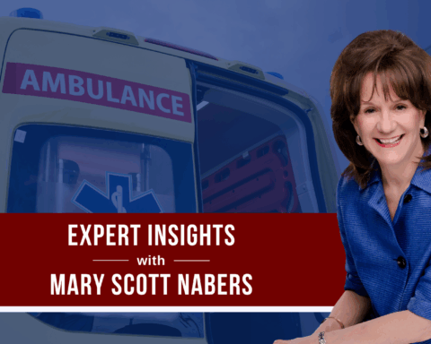Mary Scott Nabers before an ambulance for her weekly column about public safety projects.