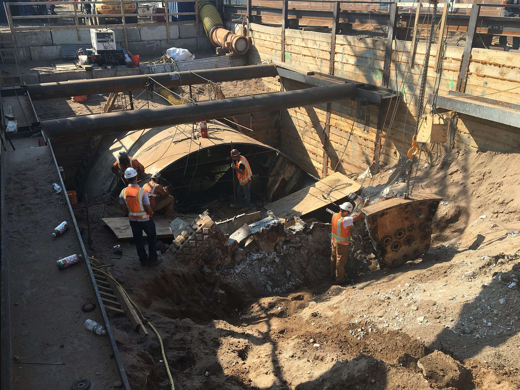 Workers with a tunnel boring machine construct a tunnel in New York City.