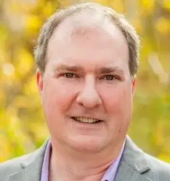 A portrait of Aaron Brockett.