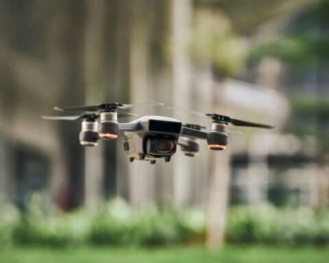 A drone floats above the ground.