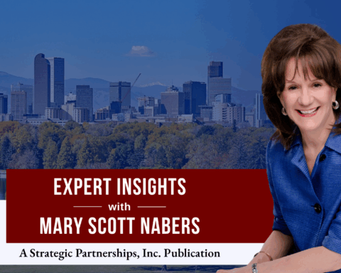 Mary Scott Nabers before the Denver skyline for her downtown revitalization project column.