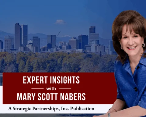 Mary Scott Nabers before the Denver skyline for her downtown revitalization project column.