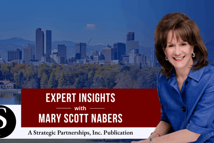 Mary Scott Nabers before the Denver skyline for her downtown revitalization project column.