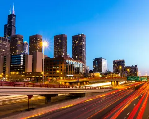 A highway near Chicago before a blue sky.
