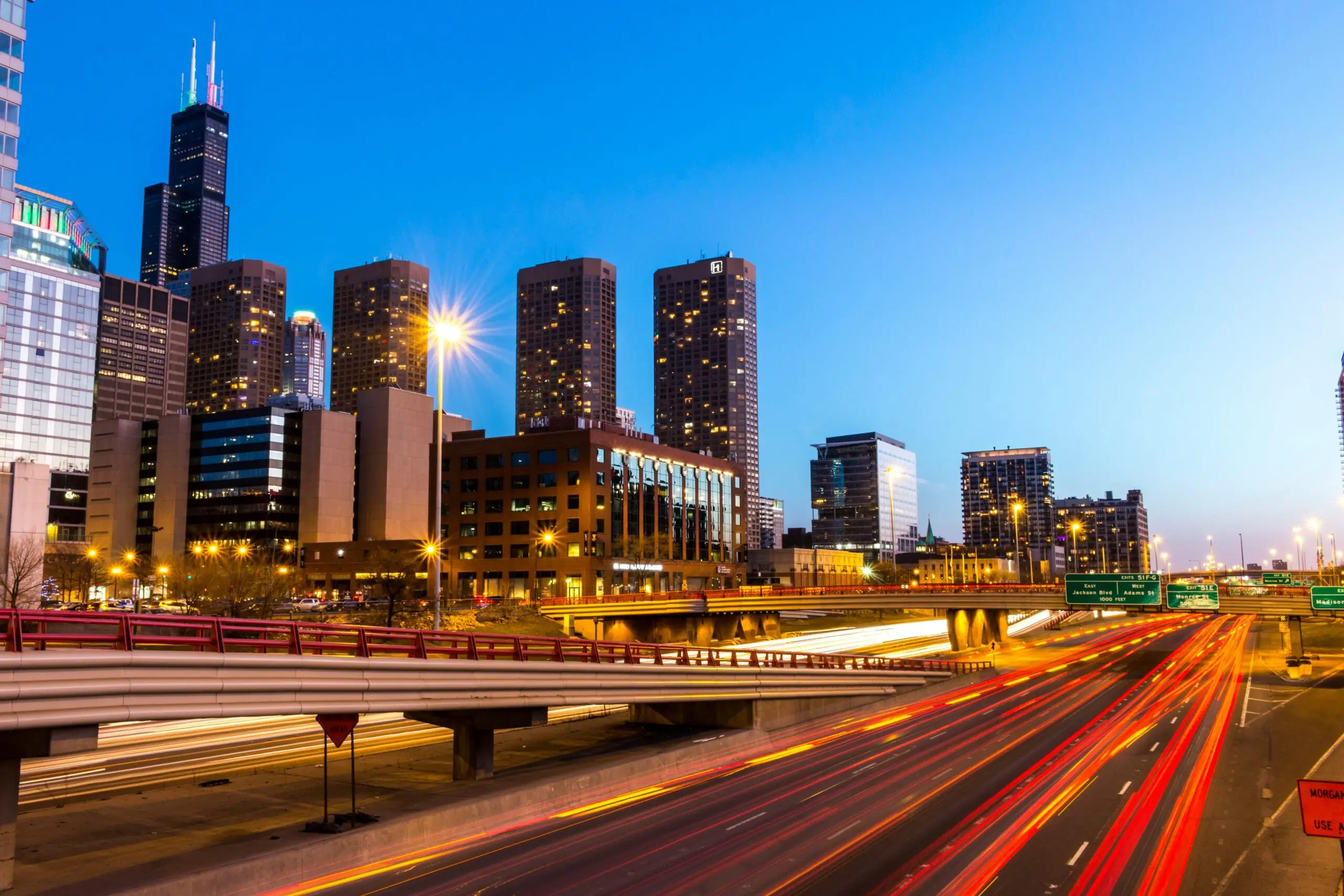 A highway near Chicago before a blue sky.