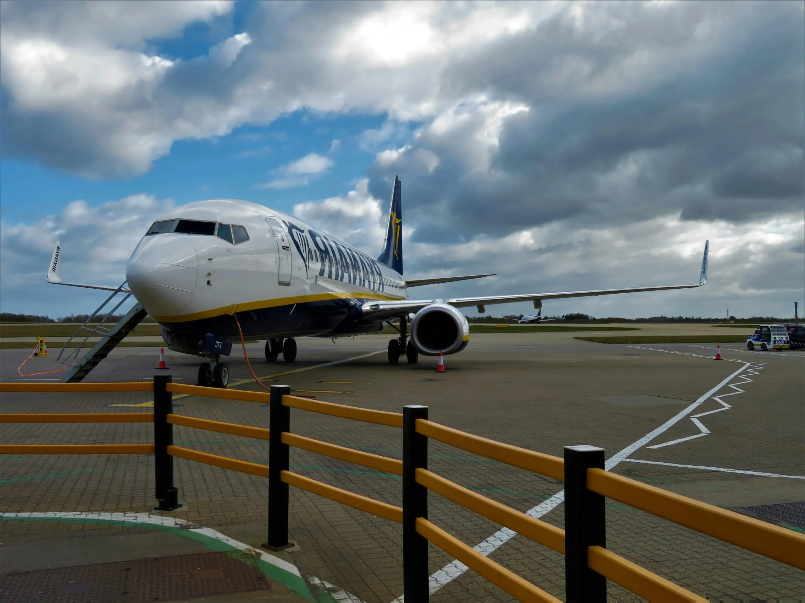 An airplane on the ground at a terminal.