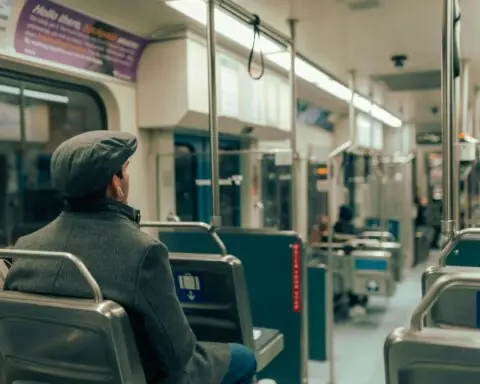 A man riding a lit train.