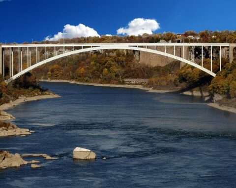 A distant view of a bridge over water.