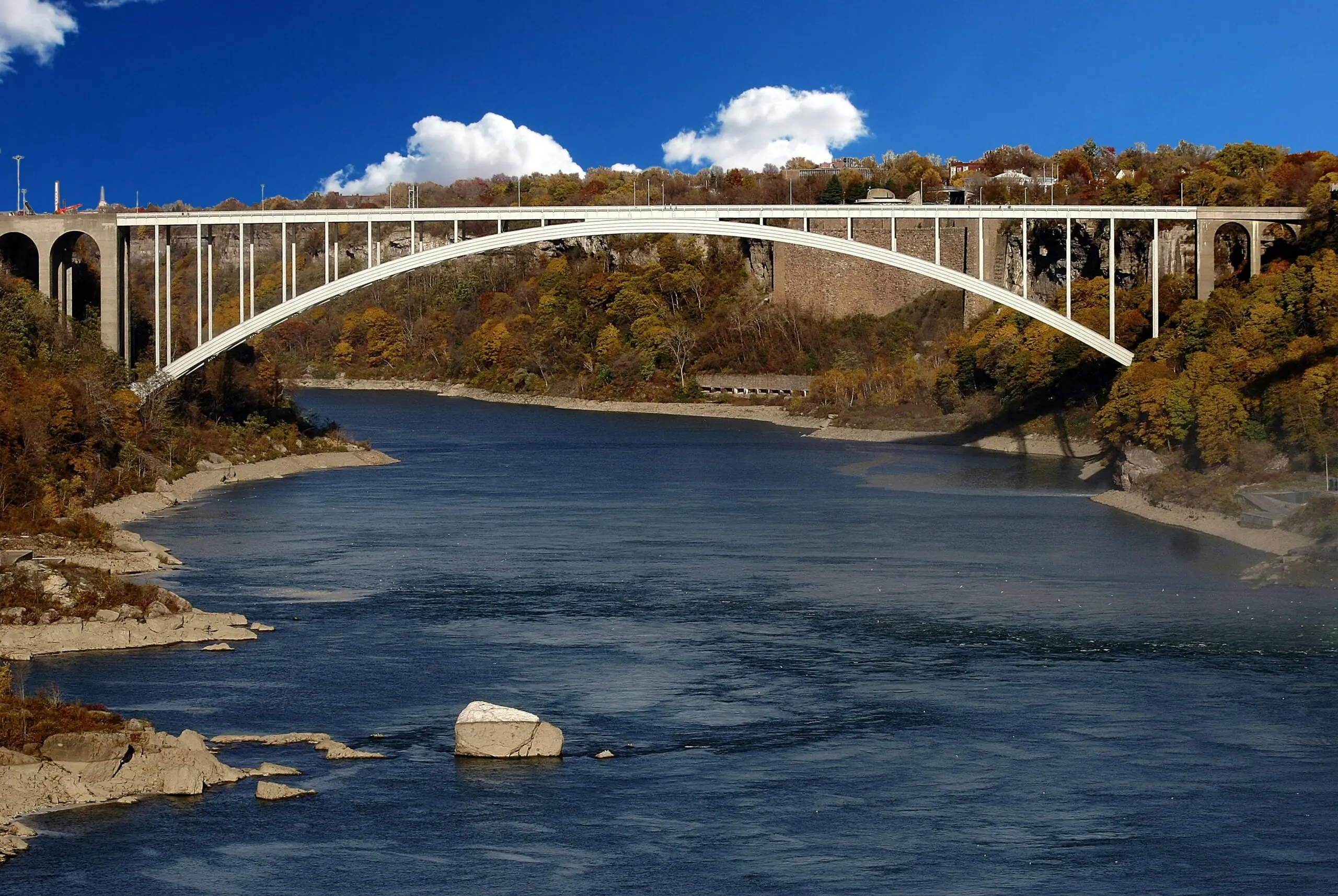 A distant view of a bridge over water.
