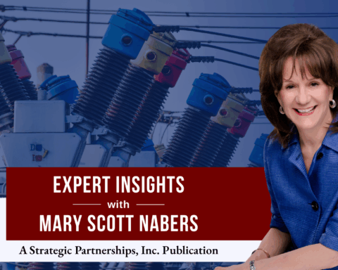 Mary Scott Nabers before an electric transformer for her weekly column.