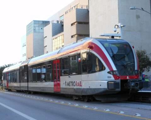 A CapMetro train on tracks in Austin.