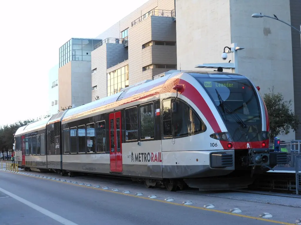 A CapMetro train on tracks in Austin.