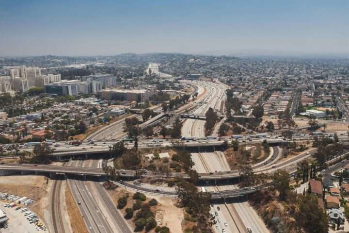 An aerial shot of California transportation infrastructure and highways in Los Angeles.