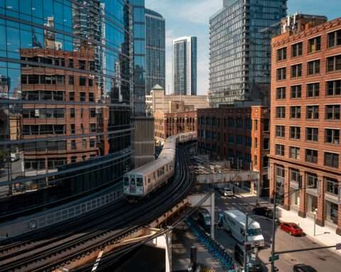 A CTA train moving through an urban area in Chicago.