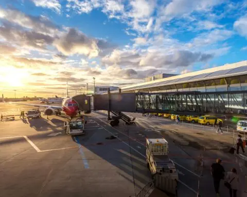 An airplane parked at a gate at an airport.