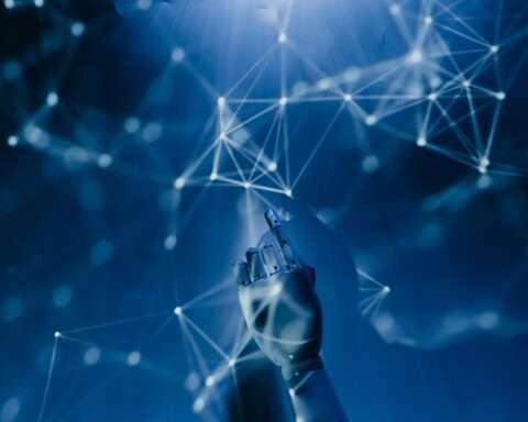 A hand reaches toward a digitized environment.