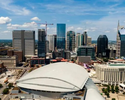 The Nashville city skyline from an equal level at a distance above the arena.