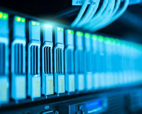 Several stacks as part of a server lit in blue light.