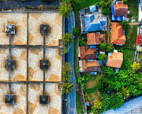 A top-down view of a municipal water treatment plant and some local houses.
