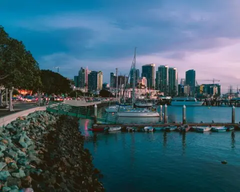 The San Diego skyline from a distance over water.