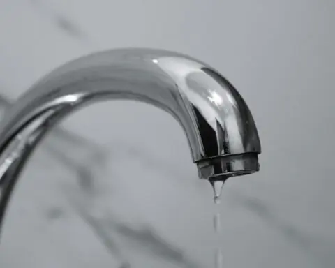 A faucet dripping water.