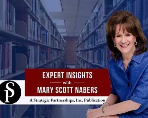 Mary Scott Nabers before an isle of books at a library for her weekly column.